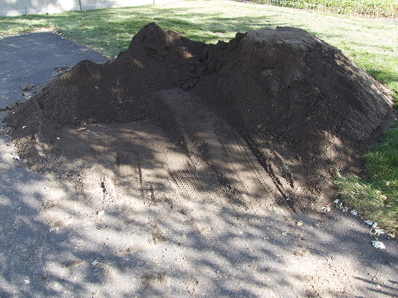 dirt pile. lawn aeration and seeding, lawn renovation, Massachusetts, Connecticut