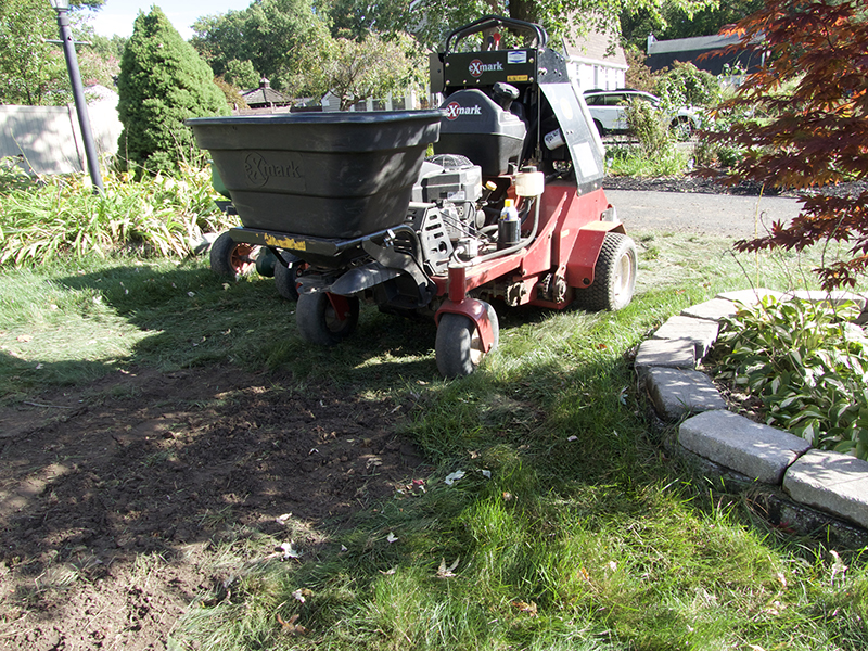 tractor working on lawn aeration and seeding, lawn renovation, Massachusetts, Connecticut